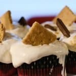 Ooey Gooey S'mores cupcakes with burnt marshmallow frosting and a buttery graham cracker crust - summer in a cupcake! kickassbaker.com #smores #cupcakes