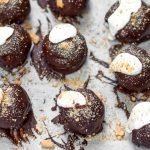 S'mores Truffles are the summer combo we all love rolled up into one perfect bite | kickassbaker.com #smores #truffles #smorestruffles #summerrecipes #easyrecipes #kickassbaker #summertime #grahamcrackers #chocolate #marshmallow #marshmallowfluff