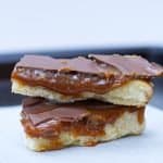 Homemade Twix Bars | kickassbaker.com #twix #homemade #twixbars #caramel #chocolate #dessertrecipes #dessert #easyrecipes #nutfree #peanutfree #allergyfriendly #bakersofinstagram #bakingrecipes #foodblogger #foodbloggerpro #bakefeed #candybarrecipe #foodphotography #foodphotoblog #foodblogfeed #f52gram #kickassbaker #feedfeedbaking #momblogger