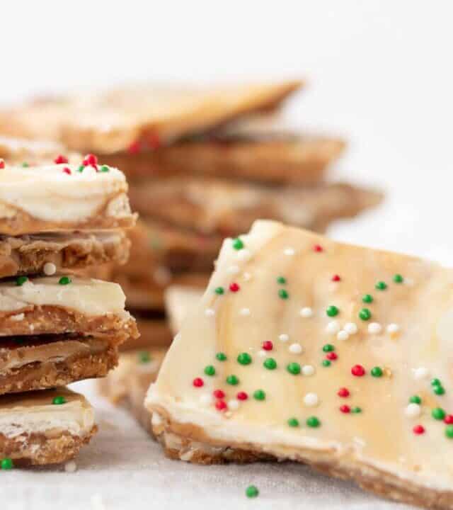 Biscoff White Chocolate Saltine Toffee | kickassbaker.com #biscoff #bark #holidaybaking #holidays #christmascookies #cookieexchange #whitechocolate #bakingrecipes #kickassbaker