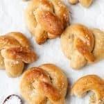 Soft pretzels on a tray with salt and mustard