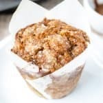 Close up shot of banana dulce de leche muffin on a white plate