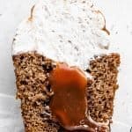 Close up shot of half a caramel-filled churro cupcake