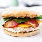 Close up of make ahead egg white gluten free breakfast sandwich with bacon and spinach
