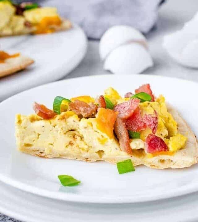 Slice of cauliflower crust breakfast pizza on a plate