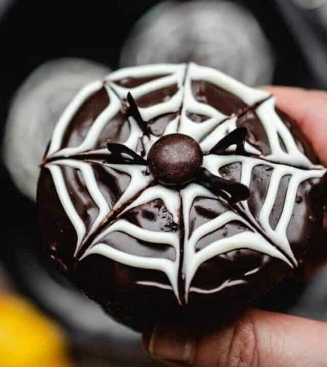 Close up photo of halloween cupcake with spider web design