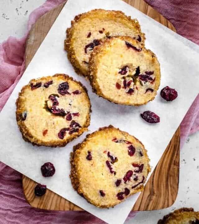 Overhead photo os shortbread cookies with cranberries around