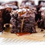 Close up image of salted caramel brownies with caramel drip