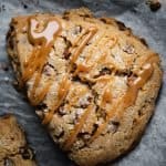 overhead close-up of a single scone drizzled with dulce de leche