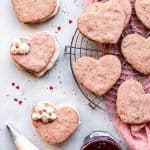 Assembling strawberries and cream cookie sandwiches