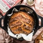 overhead of freshly baked no knead bread in a dutch oven