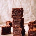 tall stack of three chewy chocolate brownies