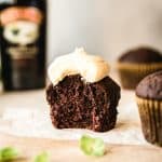 one chocolate cupcake with bite taken out