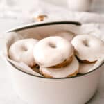 close up of baked donut with vanilla glaze
