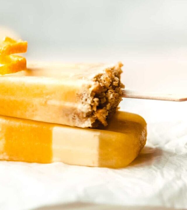 Make a batch of these delicious, creamy orange flavored creamsicles with a layer of crunchy graham cracker crumbles.