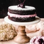 You'll be shocked at how easy the recipe is for this chocolate torte with bourbon cherry whipped cream and a dusting of powdered sugar.