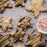 shortbread cookies drizzled with chocolate and sprinkled with crushed candy canes