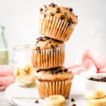 Stacked banana muffins with chocolate chips.