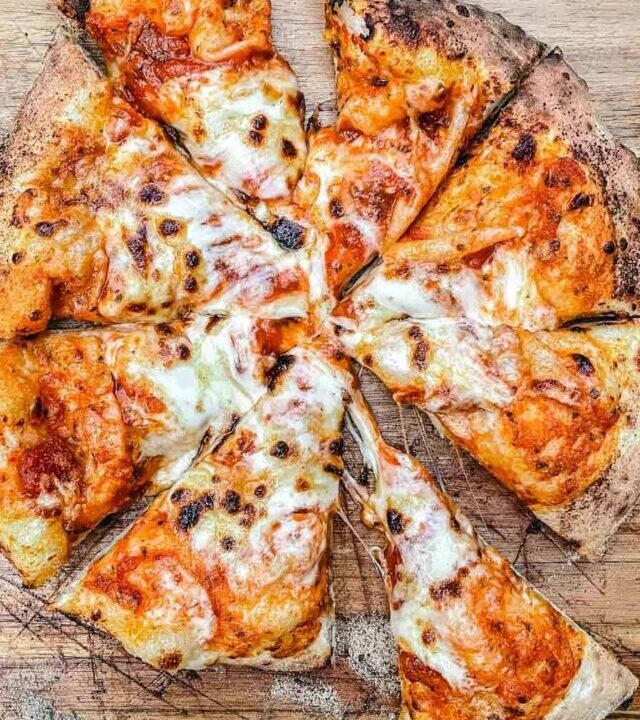 Cut up cheese pizza.