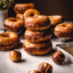 Stack of freshly made glazed donuts.