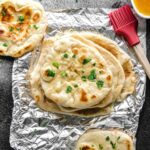 Garlic butter topped pita bread.