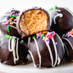 No bake Oreo truffles with a bite taken out.