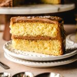 Slice of salted caramel cake with two layers.