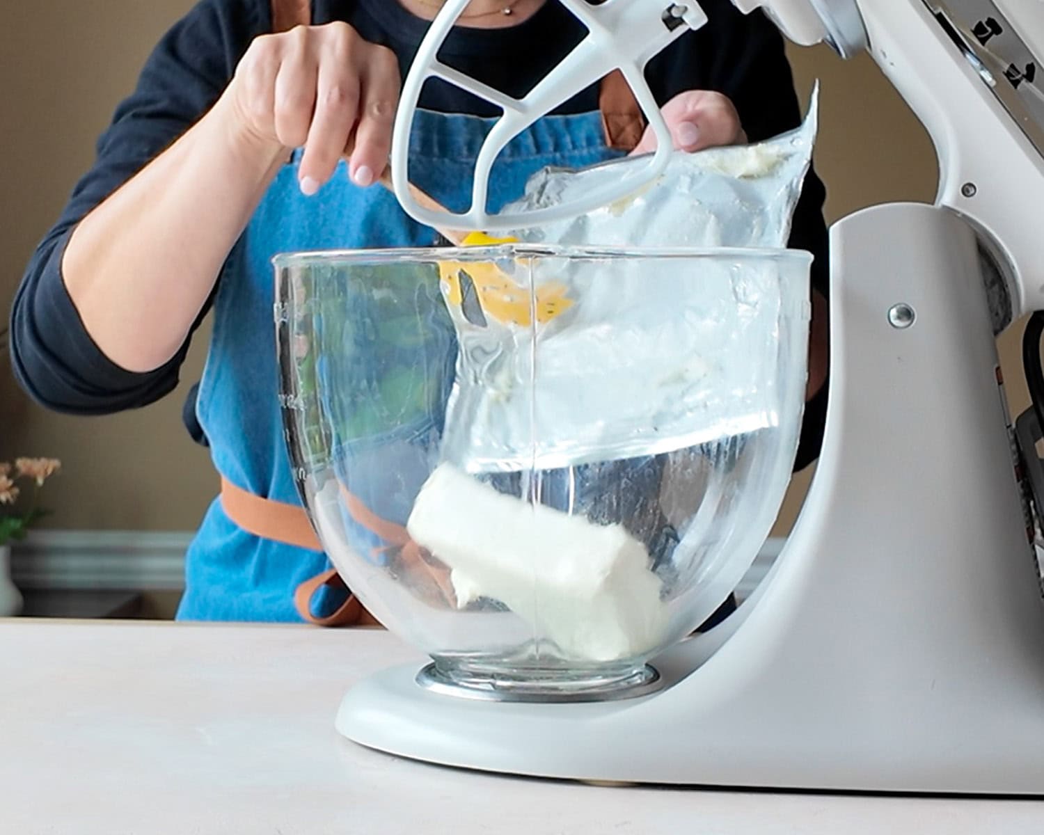 Add softened cream cheese to the bowl of a stand mixer.