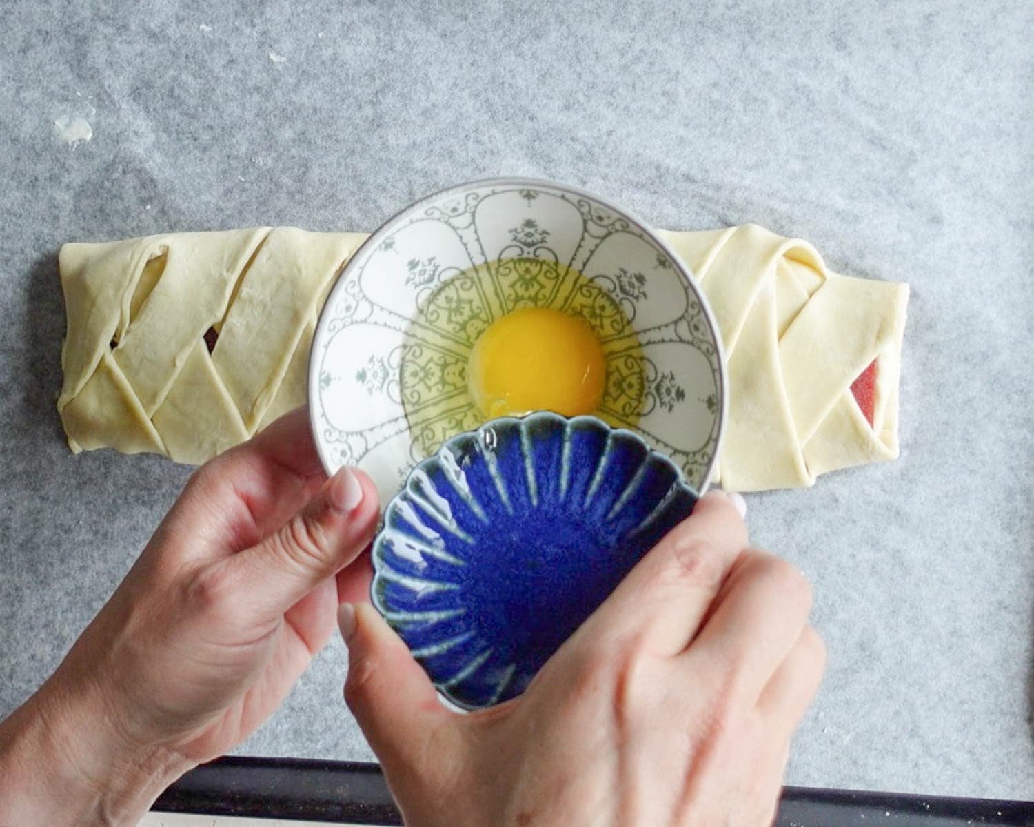 Add room temperature egg to a small bowl to make egg wash.