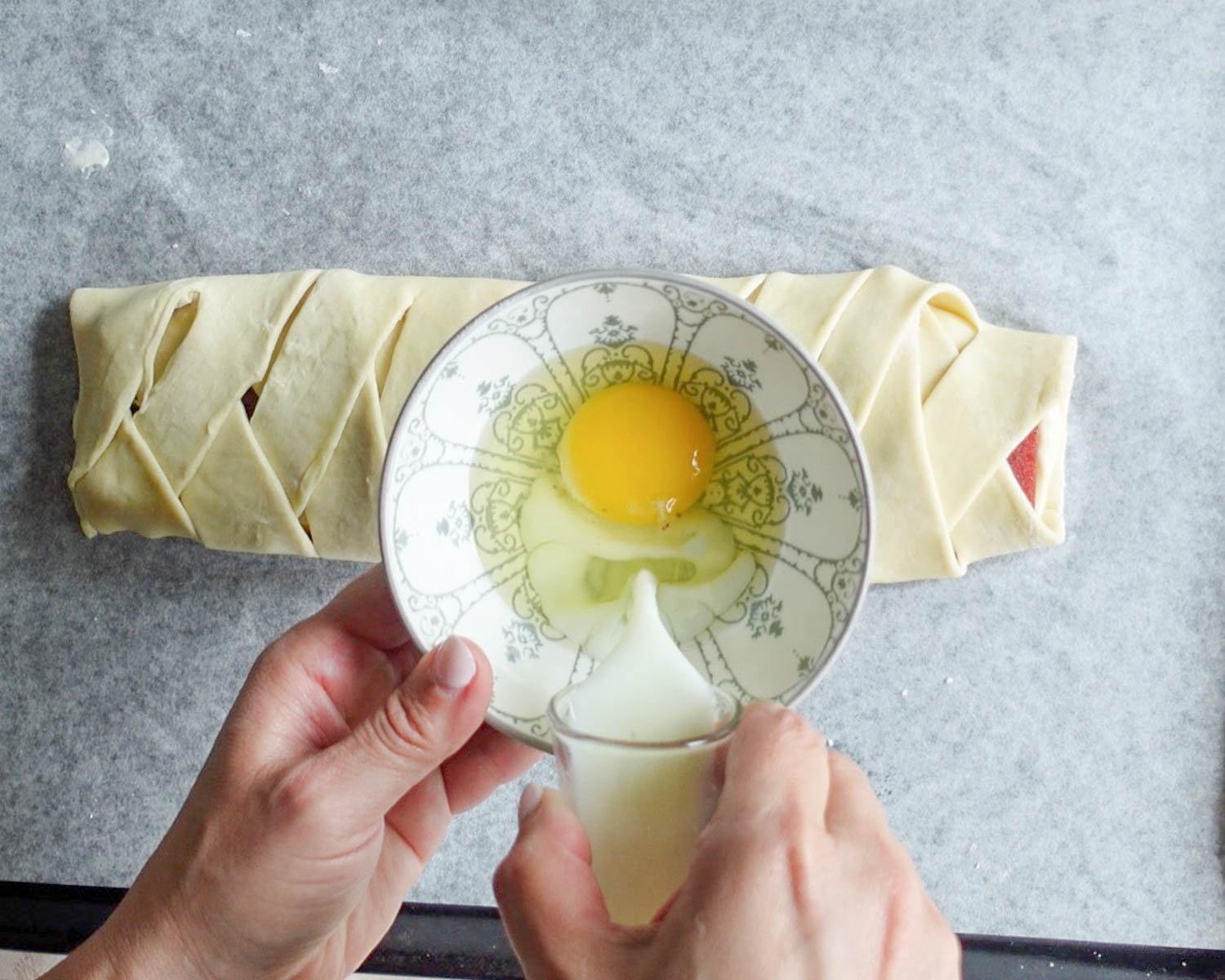 Add milk to the bowl with the egg.